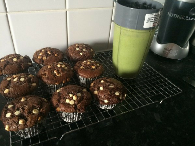 Triple chocolate muffins on a cooling rack.