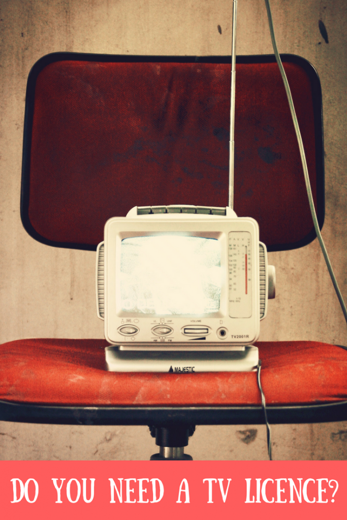 An old TV on a red office chair with text overlay that says do you need a TV licence?