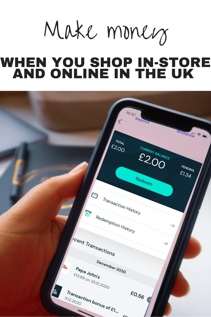 A hand holding a mobile phone which displays the Airtime Rewards app and shows a £2.00 current balance and £1.34 pending from Papa Johns spending