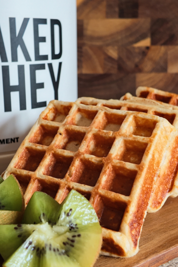 Protein waffles made using Naked Whey Grass-Fed Protein Powder served with kiwis